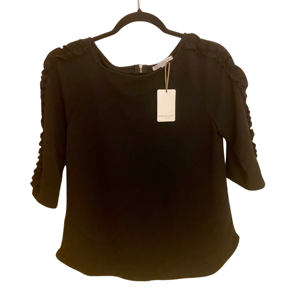 Black top with ruffles on the sleeves by Green Envelope Los Angeles